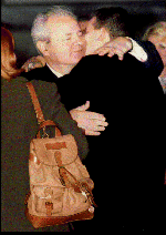 Slobodan Milosevic hugs his son, Marko